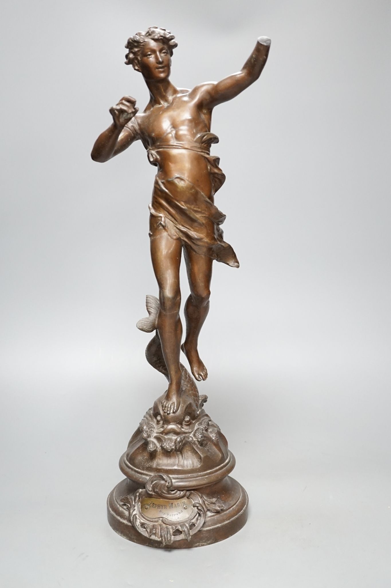 After Ferrand, a spelter figure of a gentleman upon a dolphin, plaque to base reading ‘Zephyr Marin Par Ferrand’, 50cm